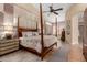 This grand bedroom showcases a canopy bed, carpet, and large upholstered headboard at 3166 N 158Th Ave, Goodyear, AZ 85395