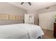 Cozy bedroom with ceiling fan, closet and adjoining bathroom access at 3166 N 158Th Ave, Goodyear, AZ 85395