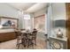 Cozy dining area with a round table, four chairs, and natural light from windows at 3166 N 158Th Ave, Goodyear, AZ 85395