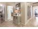 Inviting entryway featuring neutral tones, stylish decor, and tile flooring leading to other rooms of the home at 3166 N 158Th Ave, Goodyear, AZ 85395