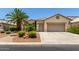 Charming home features a two-car garage and well-maintained desert landscaping, offering curb appeal at 3166 N 158Th Ave, Goodyear, AZ 85395