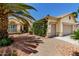Charming single story with desert landscaping, featuring a walkway to the entryway and two car garage at 3166 N 158Th Ave, Goodyear, AZ 85395