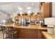 Lovely kitchen featuring a large island with seating and stainless-steel appliances at 3166 N 158Th Ave, Goodyear, AZ 85395