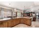 Spacious kitchen with stainless steel appliances, island cooktop, and open floorplan at 3166 N 158Th Ave, Goodyear, AZ 85395