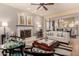 Cozy living room featuring a fireplace, comfortable seating, and stylish decor for relaxation and entertainment at 3166 N 158Th Ave, Goodyear, AZ 85395
