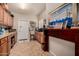 A cozy room with wood cabinets, tile floors, and a decorative fireplace creates a welcoming atmosphere at 3166 N 158Th Ave, Goodyear, AZ 85395