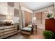 Comfortable sitting room with natural light, bamboo shades, and a chaise lounge at 3166 N 158Th Ave, Goodyear, AZ 85395