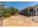 Desert home with a back porch, patio space, desert landscaping, and fenced yard at 33601 N Rifleman Rd, Cave Creek, AZ 85331