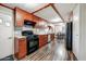Galley kitchen features wood cabinets, granite countertops, stainless steel appliances, and tile backsplash at 33601 N Rifleman Rd, Cave Creek, AZ 85331