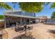 Backyard featuring brick patio, seating area and well manicured landscaping at 3545 W Tanner Ranch Rd, San Tan Valley, AZ 85144