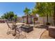 Backyard showcasing a patio, seating arrangement, and luscious landscaping at 3545 W Tanner Ranch Rd, San Tan Valley, AZ 85144