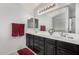 Bathroom featuring double sinks, lots of vanity storage and updated fixtures at 3545 W Tanner Ranch Rd, San Tan Valley, AZ 85144