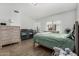 Bright bedroom featuring wood floors, a ceiling fan, and natural light at 3545 W Tanner Ranch Rd, San Tan Valley, AZ 85144