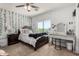 Bedroom features neutral carpet, a ceiling fan, and an abundance of natural light at 3545 W Tanner Ranch Rd, San Tan Valley, AZ 85144
