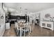 Spacious dining area with seating for six, adjacent to the kitchen and a home office at 3545 W Tanner Ranch Rd, San Tan Valley, AZ 85144