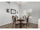 Dining room with a glass table and wrought iron chairs and decor at 3545 W Tanner Ranch Rd, San Tan Valley, AZ 85144