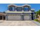 Two-story home with a two-car garage beneath matching windows at 3545 W Tanner Ranch Rd, San Tan Valley, AZ 85144