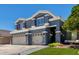 Exterior of gray home featuring manicured lawn and attached garage at 3545 W Tanner Ranch Rd, San Tan Valley, AZ 85144
