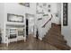 Bright foyer featuring neutral walls, wood flooring, and staircase at 3545 W Tanner Ranch Rd, San Tan Valley, AZ 85144