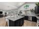 Open kitchen design with an island, stainless appliances, and eat-in dining area at 3545 W Tanner Ranch Rd, San Tan Valley, AZ 85144