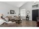 Comfortable living room with contemporary decor, plush seating and wood floors at 3545 W Tanner Ranch Rd, San Tan Valley, AZ 85144