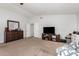 Spacious main bedroom featuring neutral carpeting and white walls for a clean, modern aesthetic at 3545 W Tanner Ranch Rd, San Tan Valley, AZ 85144