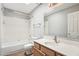 Full bathroom featuring a shower-tub combo and modern vanity at 4428 E Yawepe St, Phoenix, AZ 85044