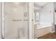 Primary bathroom with walk-in shower and jetted tub with window at 4428 E Yawepe St, Phoenix, AZ 85044
