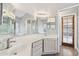 Bathroom with double sinks, vanity, and a large framed mirror at 4428 E Yawepe St, Phoenix, AZ 85044
