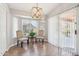 Cozy dining area featuring a bay window, stylish chandelier, and sliding door, perfect for intimate meals at 4428 E Yawepe St, Phoenix, AZ 85044
