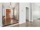 Inviting entryway with a wooden front door, tile flooring, and neutral paint, creating a warm welcome at 4428 E Yawepe St, Phoenix, AZ 85044