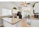 Eat-in kitchen with granite countertop, wood floors, and modern stainless appliances at 4428 E Yawepe St, Phoenix, AZ 85044