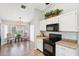 Eat-in kitchen features granite counters, wood floors, and modern appliances at 4428 E Yawepe St, Phoenix, AZ 85044