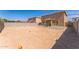 Spacious backyard with a blank slate awaiting landscaping and outdoor features at 45173 W Sandhill Rd, Maricopa, AZ 85139
