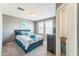 Bedroom with neutral walls, carpet, and a window with plantation shutters at 45173 W Sandhill Rd, Maricopa, AZ 85139