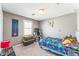 This bedroom features carpet, a window, and decorated walls at 45173 W Sandhill Rd, Maricopa, AZ 85139