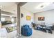 Inviting office space featuring ample desk space, a cozy blue chair, and contemporary decor at 45173 W Sandhill Rd, Maricopa, AZ 85139