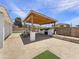 Spacious backyard with a covered patio area featuring a built-in grill and plenty of room for entertaining at 4639 W Keim Dr, Glendale, AZ 85301