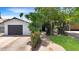 Charming single-story home features a brick driveway and walkway, manicured lawn, and a detached one-car garage at 4639 W Keim Dr, Glendale, AZ 85301