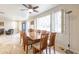 Dining room with hardwood table, seating for eight, and natural light through shuttered windows at 4719 N 70Th St, Scottsdale, AZ 85251