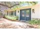 Charming home featuring a blue front door with glass panels and well-manicured landscaping at 4719 N 70Th St, Scottsdale, AZ 85251