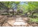 Landscaped front yard with mature trees creating a serene and inviting atmosphere at 4719 N 70Th St, Scottsdale, AZ 85251