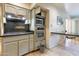 Traditional kitchen with granite counters, stainless steel appliances, and tile flooring at 4719 N 70Th St, Scottsdale, AZ 85251