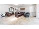 Bright living room with a skylight, travertine flooring and stylish leather furniture at 4719 N 70Th St, Scottsdale, AZ 85251