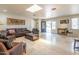 Inviting living room with travertine floors, comfortable leather furniture, and a light-filled ambiance at 4719 N 70Th St, Scottsdale, AZ 85251