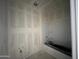 Bright bathroom showcasing a bathtub and pre-installation plumbing fixtures at 47705 W Moeller Rd, Maricopa, AZ 85139
