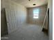 Cozy bedroom with a window view and neutral walls awaiting your personalization at 47705 W Moeller Rd, Maricopa, AZ 85139