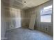 Comfortable bedroom with a window view and neutral walls ready to be designed at 47705 W Moeller Rd, Maricopa, AZ 85139