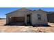 View of the home's exterior showcasing the garage and entry way prior to final construction at 47705 W Moeller Rd, Maricopa, AZ 85139