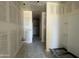 Hallway view showcasing various rooms with pre-installation fixtures awaiting your personalization at 47705 W Moeller Rd, Maricopa, AZ 85139